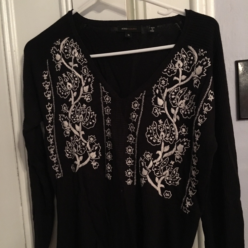 Black sweater with white embroidery. Sz S